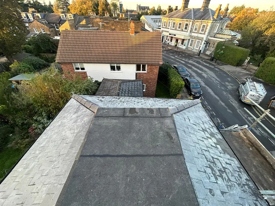 Flat dormer roof finished between grey tiled slopes, Imperial Roofcraft roofing job in London