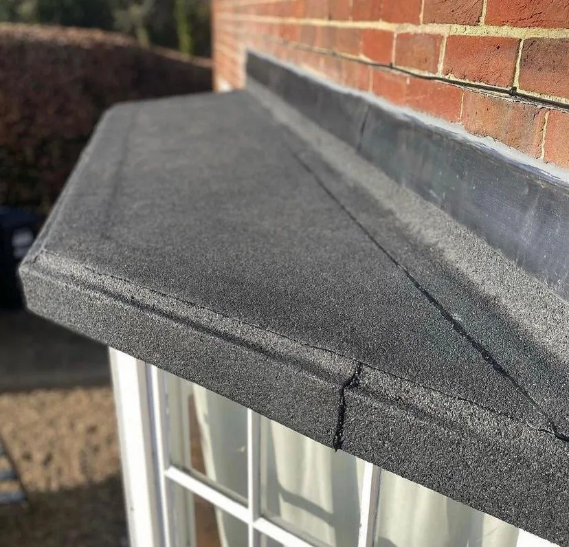 Felt flat roof edge detail above a bay window, Imperial Roofcraft roofing job in London