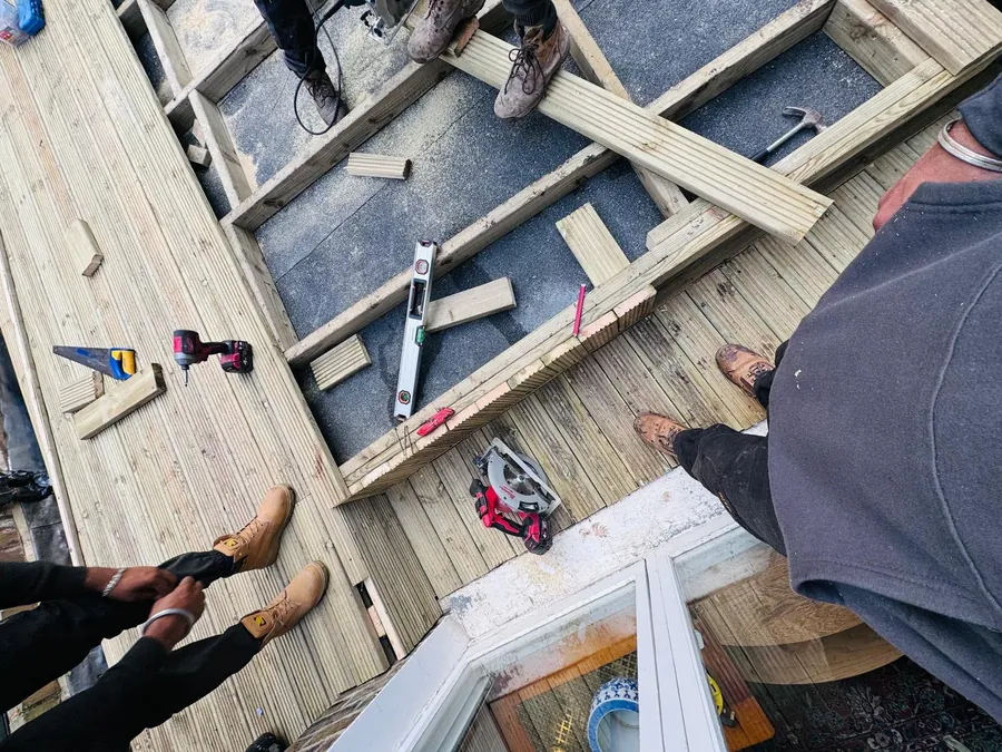 Close view of new flat roof firrings and deck boards, Imperial Roofcraft roofing job in London