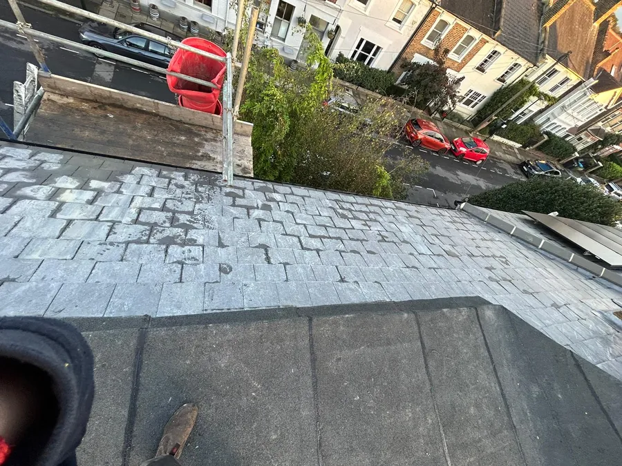 New flat roof meeting a grey tiled slope, Imperial Roofcraft roofing job in London