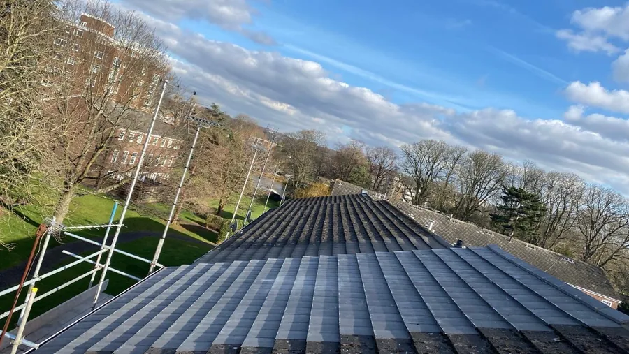 Long run of grey interlocking tiles on a re-roof, Imperial Roofcraft roofing job in London