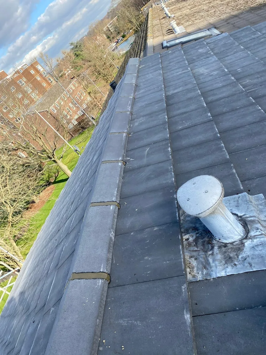 Grey tiled roof with new ridge and a soil vent, Imperial Roofcraft roofing job in London