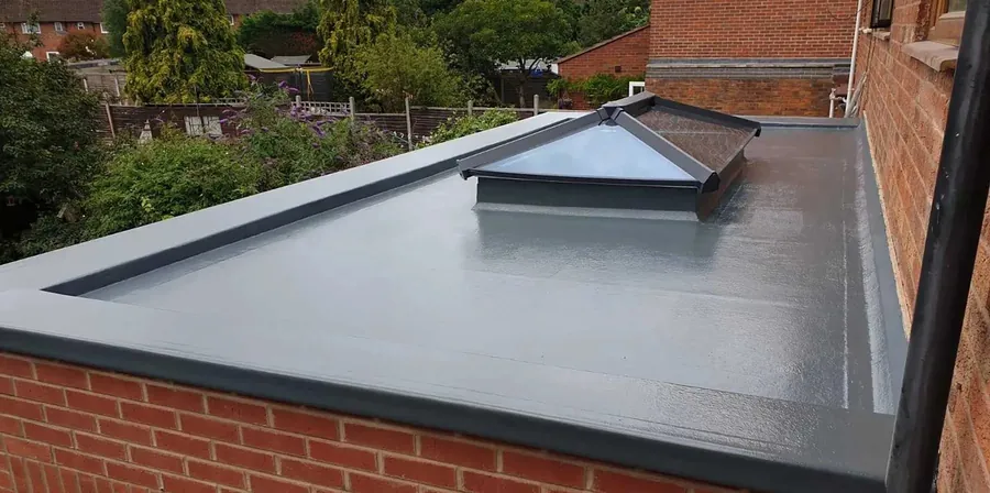 Grey GRP flat roof with a glass roof lantern, Imperial Roofcraft roofing job in London and Surrey