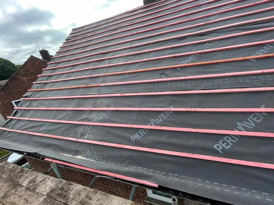 Breathable membrane and new treated battens on a stripped roof, Imperial Roofcraft roofing job in London