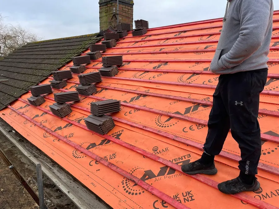 Tiles loaded out on new battens and orange membrane, Imperial Roofcraft roofing job in London and Surrey