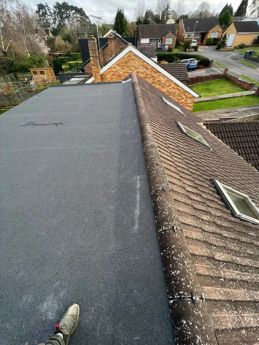 New single-ply flat roof on a dormer beside a tiled slope, Imperial Roofcraft roofing job in London and Surrey