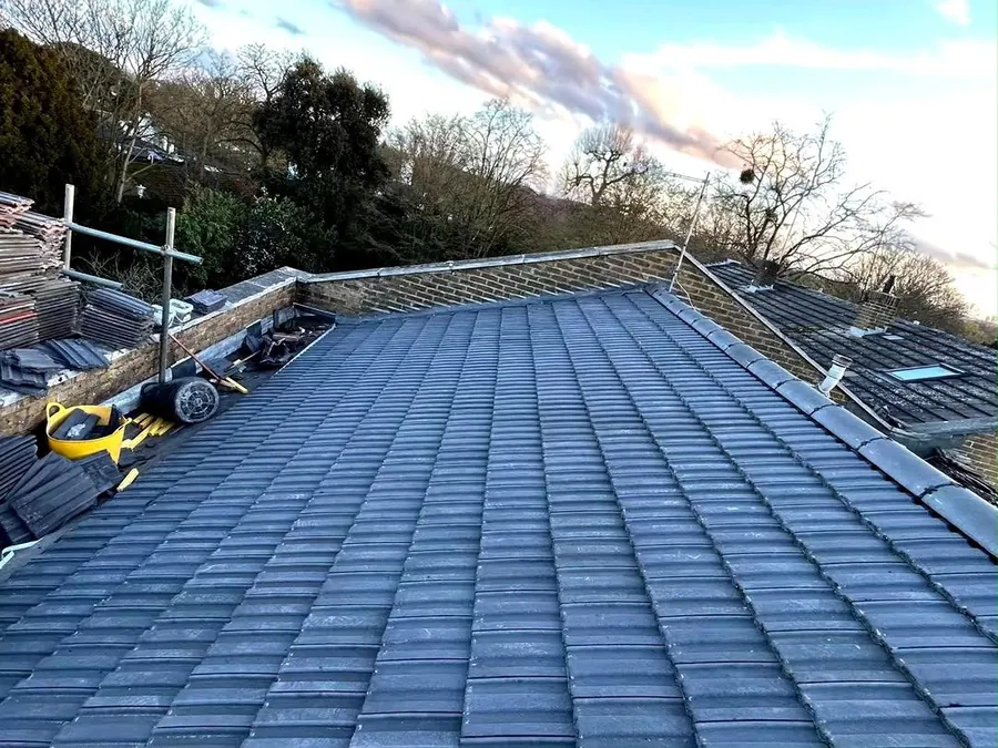New grey tiled roof completed from start to finish in Kingston, new membrane, battens, tiles and ridge caps