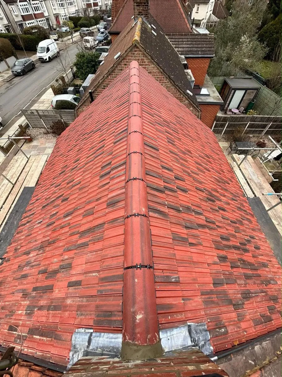 New red tile roof with ridge and lead at the junction, Imperial Roofcraft roofing job in London and Surrey