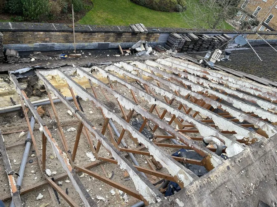 Roof stripped back to the trusses during a full re-roof, Imperial Roofcraft roofing job in London and Surrey