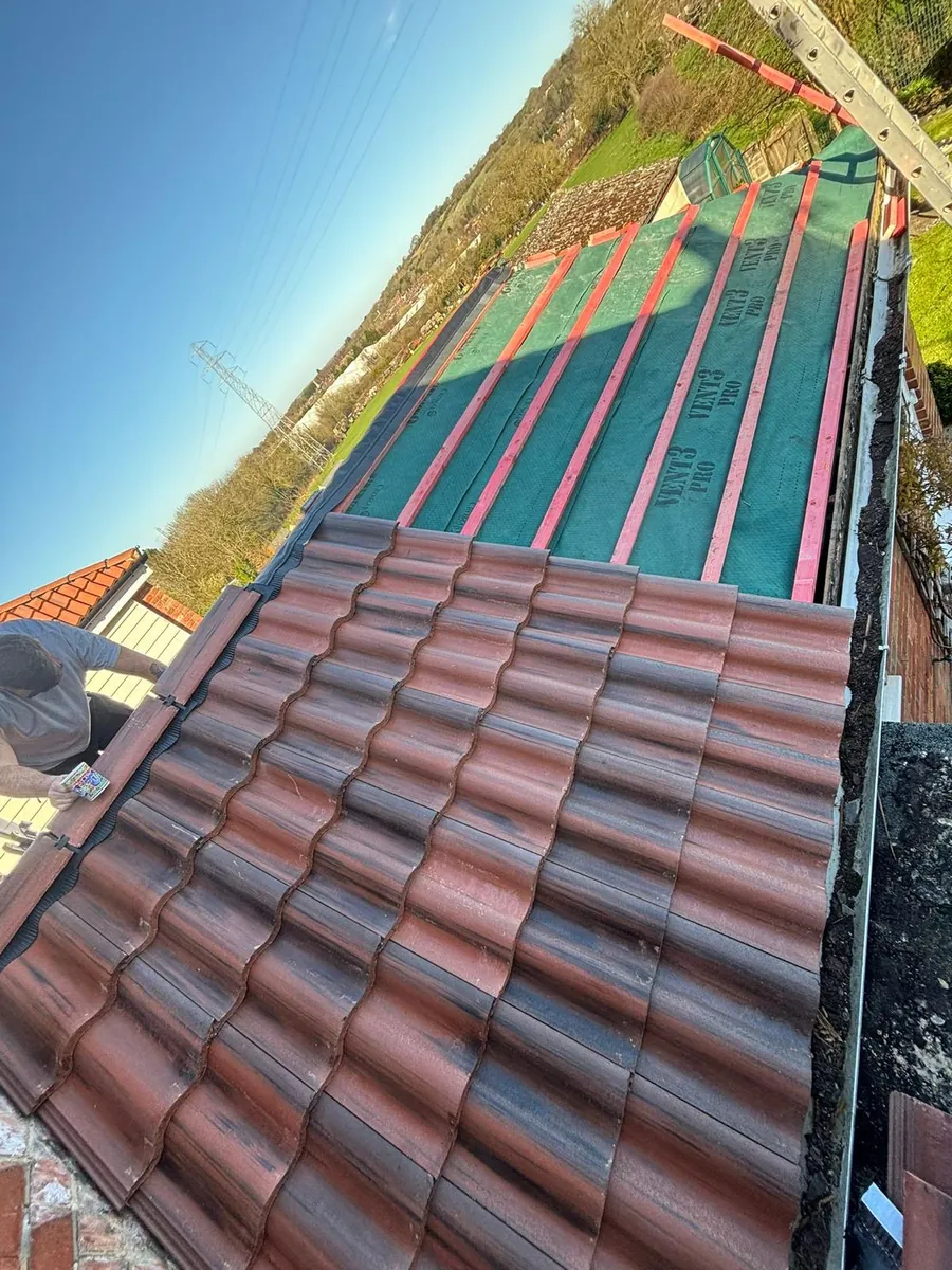 Red tiles laid up to fresh membrane and battens, Imperial Roofcraft roofing job in London and Surrey
