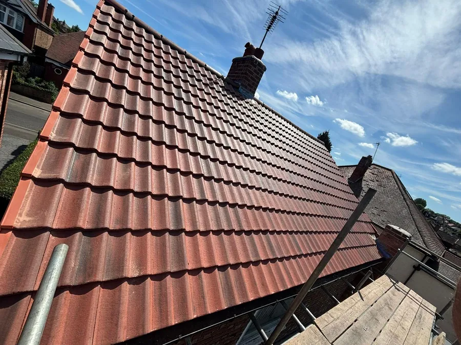Red tiled roof with twin chimney stacks, Imperial Roofcraft roofing job in London and Surrey