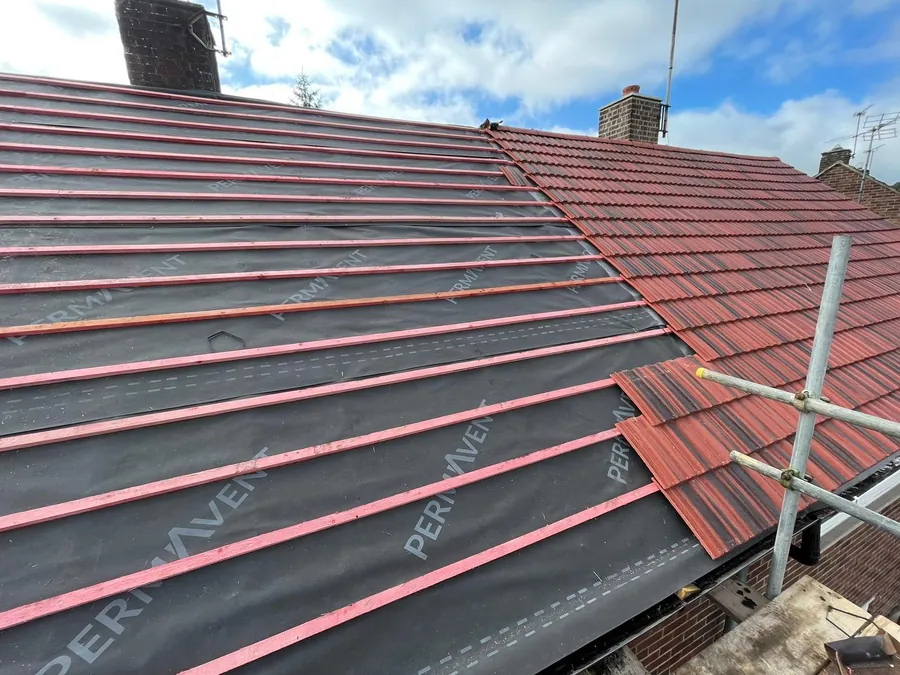 Red tiles stacked on new battens over breathable membrane, Imperial Roofcraft roofing job in London