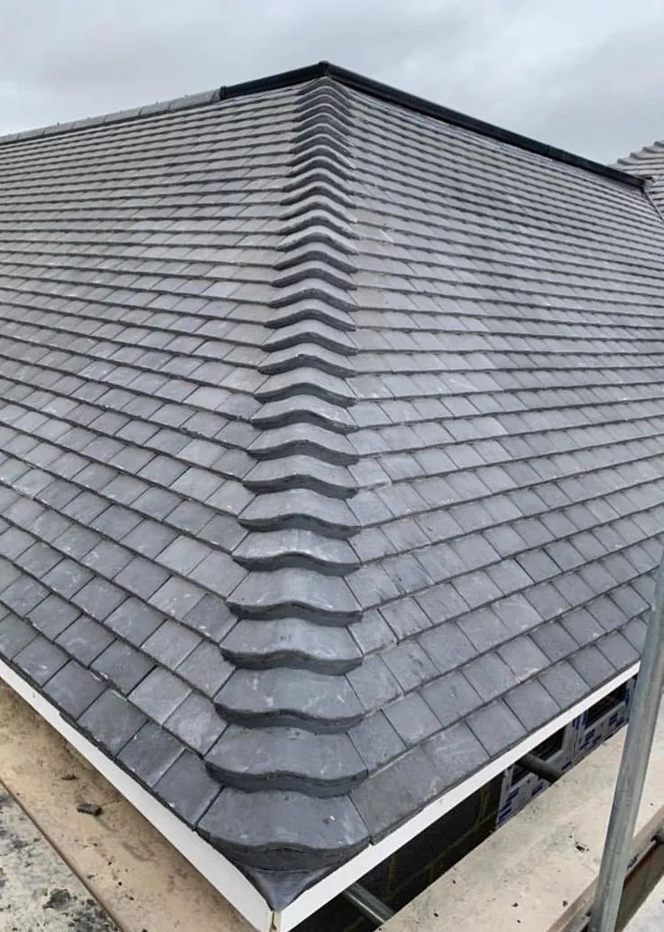 Finished slate-effect hip roof on a house extension, Imperial Roofcraft roofing job in London